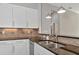 Kitchen sink and countertop with granite and white cabinets at 111 172Nd E St, Bradenton, FL 34212