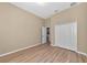 Light and airy bedroom with wood-look flooring and double door closet at 111 172Nd E St, Bradenton, FL 34212