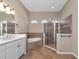 Spa-like bathroom with a soaking tub, walk-in shower, and updated vanity at 111 172Nd E St, Bradenton, FL 34212