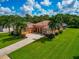 Luxury home with a large yard and palm trees at 111 172Nd E St, Bradenton, FL 34212