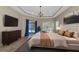 Main bedroom with a king-size bed and access to the pool at 111 172Nd E St, Bradenton, FL 34212