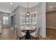 Bright breakfast nook with a round table and chairs, overlooking the pool at 111 172Nd E St, Bradenton, FL 34212