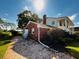 Brick house exterior with a large tree and paved driveway at 1303 51St W St, Bradenton, FL 34209