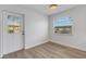 Simple bedroom with wood-look floors and neutral walls at 1902 Andover St # 213, Sun City Center, FL 33573