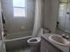 Bathroom with a toilet, sink, and bathtub at 4665 Jaslo Ave, North Port, FL 34286