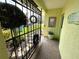 Inviting gated entryway with decorative wrought iron gate and lush landscaping at 6812 11Th W Ave # 6812, Bradenton, FL 34209