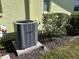 Close-up of the home's exterior unit set amidst well-maintained landscaping at 6812 11Th W Ave # 6812, Bradenton, FL 34209