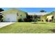 Charming home exterior with a well-manicured lawn, garage, and inviting curb appeal at 6812 11Th W Ave # 6812, Bradenton, FL 34209