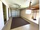 Attached garage with a functional automatic door and storage space at 6812 11Th W Ave # 6812, Bradenton, FL 34209