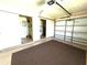 Spacious garage with storage room, shelving, and garage door provides parking and organization at 6812 11Th W Ave # 6812, Bradenton, FL 34209