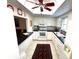 Well lit eat-in kitchen featuring white cabinets, black countertops, and stainless steel appliances at 6812 11Th W Ave # 6812, Bradenton, FL 34209