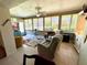 Spacious lanai featuring tile floor, ceiling fan, and view of landscaping at 6812 11Th W Ave # 6812, Bradenton, FL 34209