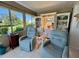 Comfortable lanai with two recliners and shelving for decorations at 6812 11Th W Ave # 6812, Bradenton, FL 34209