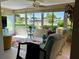 Comfortable lanai featuring bright rug, and view of the community pool at 6812 11Th W Ave # 6812, Bradenton, FL 34209