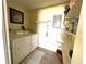 Functional laundry room with washer, dryer, shelving, and ample storage for convenience at 6812 11Th W Ave # 6812, Bradenton, FL 34209
