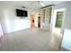 Bright main bedroom with tile floors, built-in shelving and an access door to the main bathroom at 6812 11Th W Ave # 6812, Bradenton, FL 34209