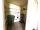 Spacious utility room features a water heater, storage shelves, and ample space for organization at 6812 11Th W Ave # 6812, Bradenton, FL 34209