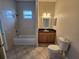 Bathroom with shower/tub combo, granite vanity and tile flooring at 434 Perdido St, North Port, FL 34287