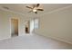 Spacious main bedroom with carpet and ceiling fan at 7114 Quiet Creek Dr, Bradenton, FL 34212
