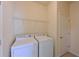 Laundry room with washer, dryer, and shelving at 7114 Quiet Creek Dr, Bradenton, FL 34212
