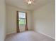Simple bedroom with ceiling fan and window at 7114 Quiet Creek Dr, Bradenton, FL 34212