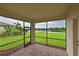 Relaxing screened porch overlooking a peaceful lake and lush landscape at 7114 Quiet Creek Dr, Bradenton, FL 34212