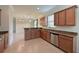 Modern kitchen with granite countertops and wood cabinets at 7114 Quiet Creek Dr, Bradenton, FL 34212