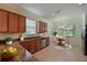 Modern kitchen with granite countertops and wooden cabinets at 7114 Quiet Creek Dr, Bradenton, FL 34212