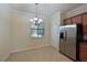 Bright breakfast nook with tile floors and a view to backyard at 7114 Quiet Creek Dr, Bradenton, FL 34212