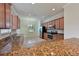 Modern kitchen with granite countertops and stainless steel appliances at 7114 Quiet Creek Dr, Bradenton, FL 34212