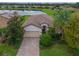 Single-story home with tile roof, solar panels, and landscaped yard at 7114 Quiet Creek Dr, Bradenton, FL 34212