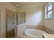 Bathroom featuring a large garden tub and shower at 7114 Quiet Creek Dr, Bradenton, FL 34212