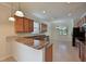 Modern kitchen with granite countertops and stainless steel appliances at 7114 Quiet Creek Dr, Bradenton, FL 34212