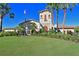 Community clubhouse with landscaping and flag at 7114 Quiet Creek Dr, Bradenton, FL 34212
