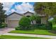 One-story house with a two-car garage and manicured lawn at 7114 Quiet Creek Dr, Bradenton, FL 34212