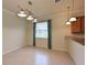 Bright dining area with wood floors and a view into the kitchen at 7114 Quiet Creek Dr, Bradenton, FL 34212