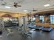 Fitness center featuring treadmills, weight machines, and ample space at 7114 Quiet Creek Dr, Bradenton, FL 34212