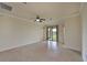 Living Room with tile floors and access to the patio at 7114 Quiet Creek Dr, Bradenton, FL 34212