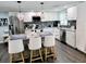 Modern kitchen with white cabinets, granite countertops, and a spacious island at 2244 Palm Ter, Sarasota, FL 34231