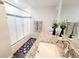 Clean bathroom with a shower/tub combo and granite countertop at 2244 Palm Ter, Sarasota, FL 34231