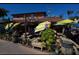 The outdoor seating area of a restaurant with picnic tables and umbrellas at 2244 Palm Ter, Sarasota, FL 34231