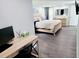 Main bedroom with a large bed and home office space at 2244 Palm Ter, Sarasota, FL 34231
