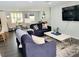 Living room with two sofas, a coffee table, and a large flat screen TV at 2244 Palm Ter, Sarasota, FL 34231