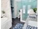 Modern bathroom with a soaking tub, walk-in shower, and double sinks at 2244 Palm Ter, Sarasota, FL 34231