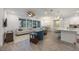 Spacious living room with light colored sofas and hardwood floors at 383 Aruba Cir # 101, Bradenton, FL 34209