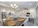 Kitchen island with seating, and dining table with chandelier at 383 Aruba Cir # 101, Bradenton, FL 34209