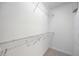 Walk-in closet with wire shelving and hanging rods at 383 Aruba Cir # 101, Bradenton, FL 34209