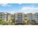 Three-story building with light gray exterior and white trim at 383 Aruba Cir # 101, Bradenton, FL 34209