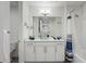 Bathroom with single vanity, tub shower combination, and white cabinets at 383 Aruba Cir # 101, Bradenton, FL 34209