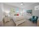 Bedroom with a full-size bed, nightstands, and colorful decor at 383 Aruba Cir # 101, Bradenton, FL 34209